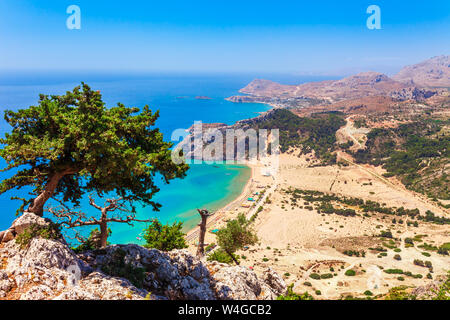 Sea skyview landscape photo Tsambika bay on Rhodes island, Dodecanese, Greece. Panorama with nice sand beach and clear blue water. Famous tourist dest Stock Photo