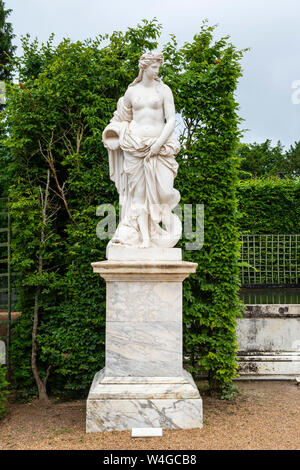 L'Eau statue (by Pierre Legros) next to Daybreak Fountain - Palace of Versailles Gardens, Yvelines, Île-de-France region of France Stock Photo