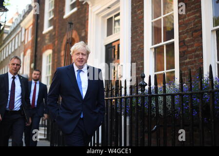 Newly elected leader of the Conservative party Boris Johnson leaves his office in Westminster, London, after it was announced he had won the leadership ballot and will become the next Prime Minister. Stock Photo