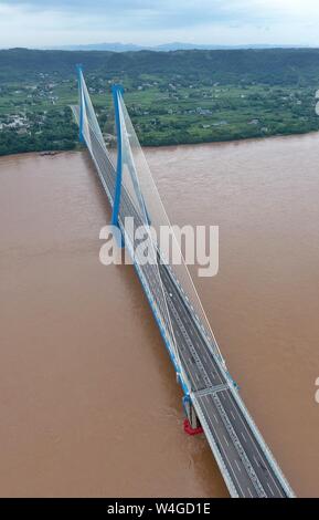 Yibin. 30th Jan, 2019. Aerial photo taken on July 23, 2019 shows Nanxi Xianyuan Yangtze River Bridge in Nanxi District of Yibin City, southwest China's Sichuan Province. The bridge opened to the public traffic on Jan. 30, 2019, by which local residents no longer need a ferry to cross the river. Credit: Liu Kun/Xinhua/Alamy Live News Stock Photo