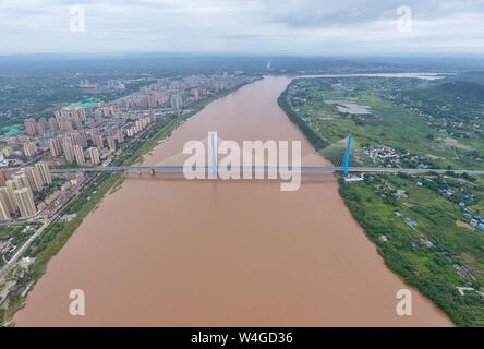 Yibin. 30th Jan, 2019. Aerial photo taken on July 23, 2019 shows Nanxi Xianyuan Yangtze River Bridge in Nanxi District of Yibin City, southwest China's Sichuan Province. The bridge opened to the public traffic on Jan. 30, 2019, by which local residents no longer need a ferry to cross the river. Credit: Liu Kun/Xinhua/Alamy Live News Stock Photo