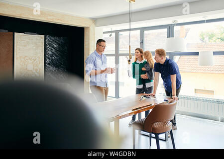 Family shopping for new furniture in showroom Stock Photo