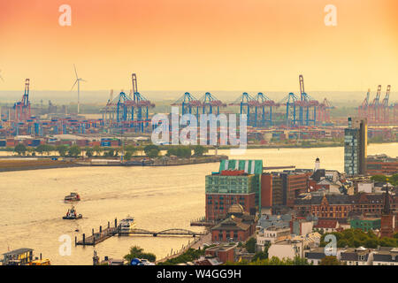 View of harbor and Landing Stages at dusk, St. Pauli, Hamburg, Germany Stock Photo