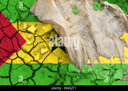The flag of Sao Tome and Principe, the flag is depicted on cracked earth. Ecology concept with environmental pollution from household and industrial w Stock Photo