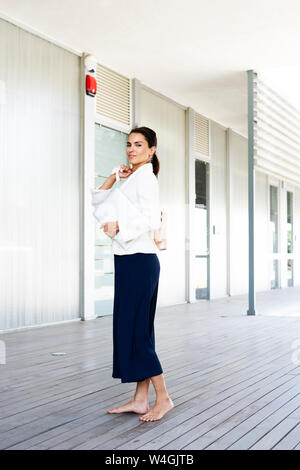 Female ballet dancer in front of an office during work Stock Photo