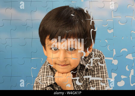 Jigsaw puzzle on a boy Stock Photo