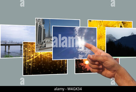 Human finger selecting an image on virtual screen Stock Photo