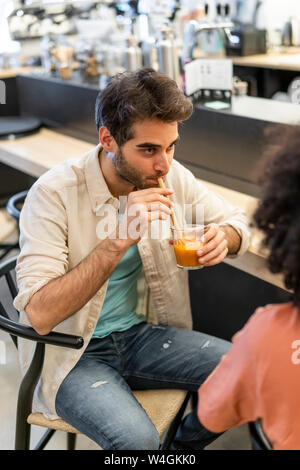 Two men meeting in a bar Stock Photo