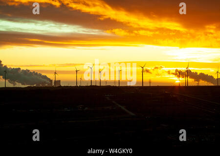 Garzweiler brown coal mining at sunrise with wind park in the background, Juechen, Germany Stock Photo