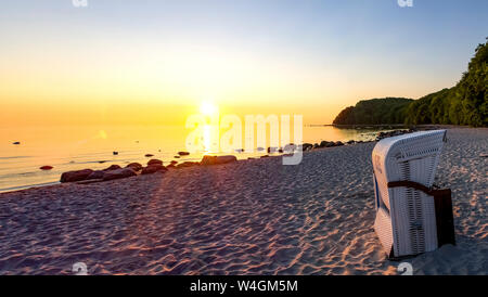 View to the beach with hooded beach chair at twilight, Binz, Ruegen, Germany Stock Photo