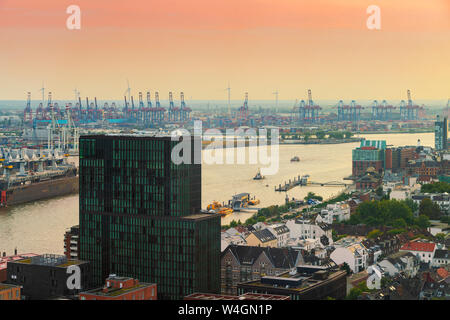 View of harbor and Landing Stages at dusk, St. Pauli, Hamburg, Germany Stock Photo