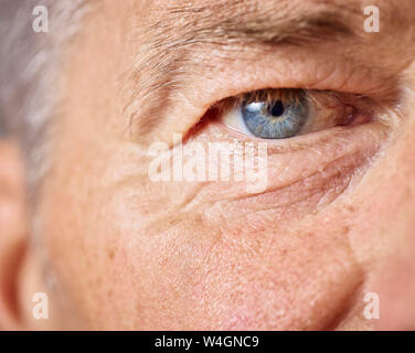 Blue eye of mature man Stock Photo