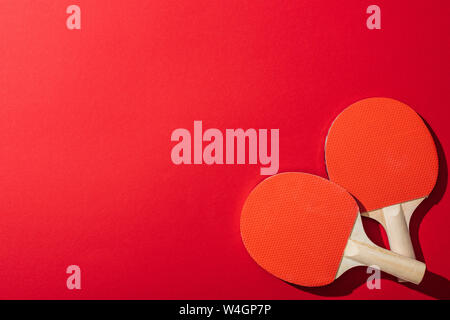 top view of table tennis rackets isolated on red Stock Photo