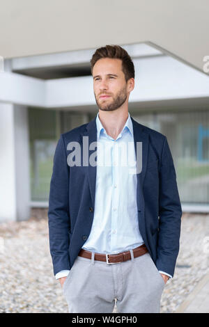 Confident businessman standing outdoors Stock Photo