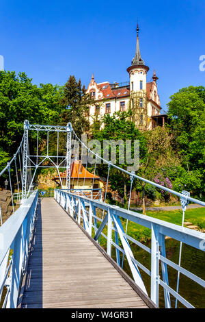 View to Gattersburg with suspension bridge in the foreground, Grimma, Germany Stock Photo