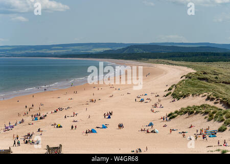 Lossiemouth East Beach, Lossiemouth, Moray, Scotland. 23rd July 2019. UK Weather: UK. Holidaymakers have flocked to the Beach at Lossiemouth as temperatures hit 30c. Credit:- JASPERIMAGE/AlamyLiveNews Stock Photo