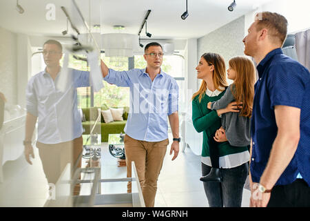 Family shopping for a new kitchen in showroom Stock Photo