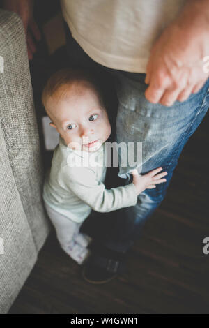 baby trying to stand up Stock Photo - Alamy