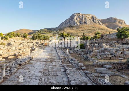 Archaeological site with Lechaion street and view on Acrocorinth, Corinth, Greece Stock Photo