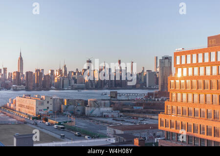 Skyline at sunset seen from Williamsburg, New York City, USA Stock Photo