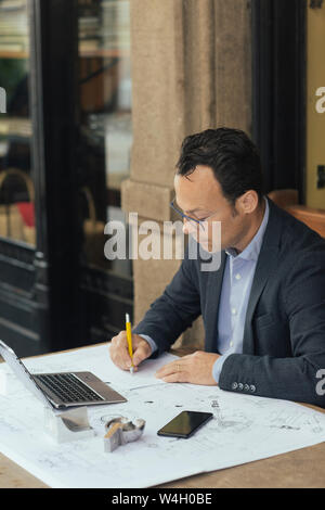 Businessman at work in a coffee shop Stock Photo