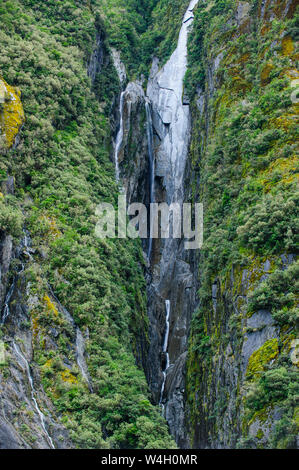 Huge waterfall on the bottom of the Franz Josef Glacier, South Island, New Zealand Stock Photo