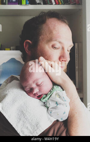 Father holding his newborn son Stock Photo