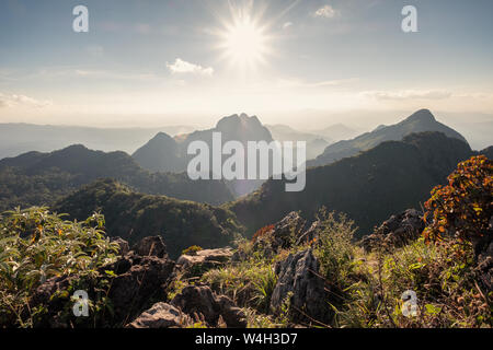 Sunshine over mountain range in wildlife sanctuary at Doi Luang Chiang Dao, Thailand Stock Photo