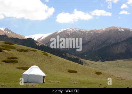 Yurt on a mountain landscape. Near Bokonbayevo. Issyk-Kul province. Kyrgyzstan Stock Photo