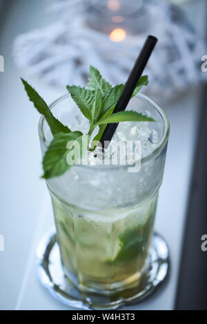 Fresh Cocktail with green leafs and lime Stock Photo