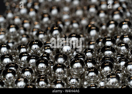 silver balls spheres many of in a shop Stock Photo
