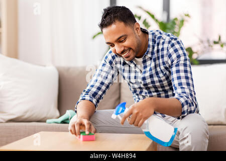 Man cleaning table Stock Photo by ©belchonock 105176182
