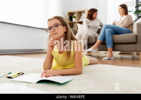 student girl with notebook and dreaming at home Stock Photo