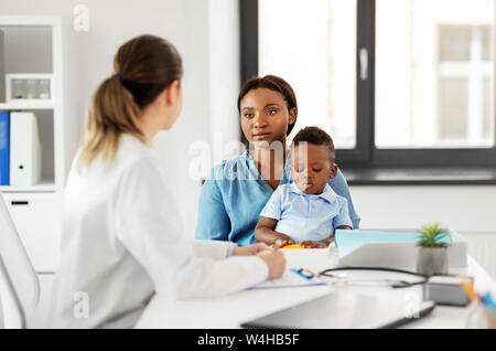 mother with baby son and doctor at clinic Stock Photo