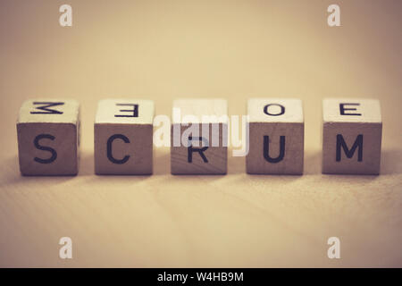 wooden cubes showing the word scrum on a table, office Stock Photo