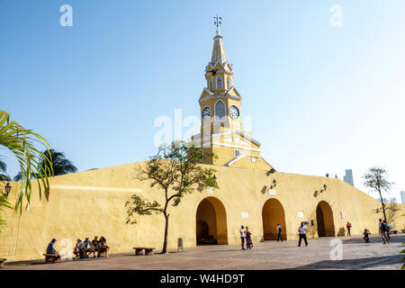 Colombia Cartagena Old Walled City Center historic centre Puerta del Reloj main city gate clock tower steeple public plaza sightseeing visitors Stock Photo