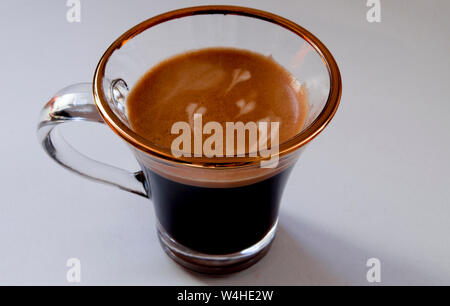 Espresso coffee with thick foam and milk hearts. Stock Photo