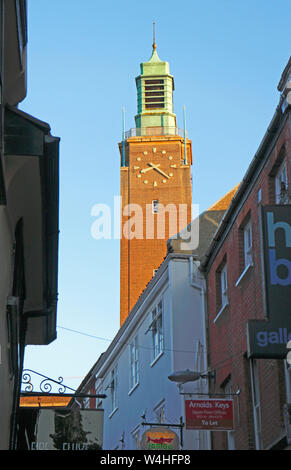 A view of the clock tower of Norwich City Hall from the Lanes in Norwich, Norfolk, England, United Kingdom, Europe. Stock Photo