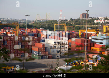 Halifax, Nova Scotia- August 2, 2017: Containers and boxes ready to be shipped or received at the Fairview terminal with MacDonald bridge behind Stock Photo