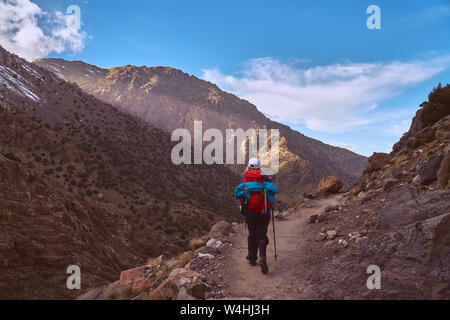 Hiker girl on the tourist path in High Atlas mountains in Jebel Toubkal region Morocco Africa Stock Photo