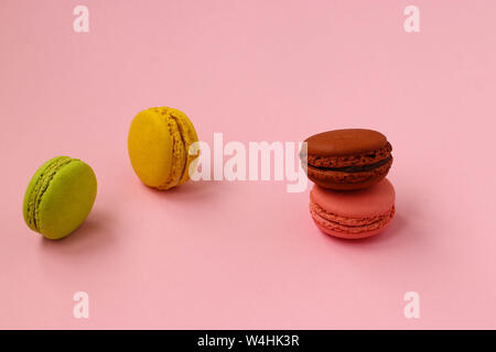 Colorful french cookies macaroons on pink background, Copy space, horizontal photo Stock Photo