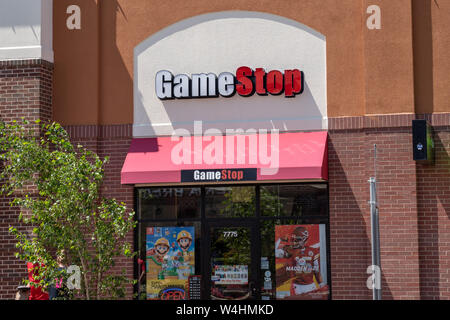 Maple Grove, Minnesota - July 21, 2019: Exterior of a GameStop retail store. This retail chain specializes in video game and consoules sales Stock Photo