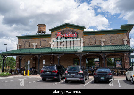 Maple Grove, Minnesota - July 21, 2019: Exterior of a Portillos Hot Dog restaurant, known for their famous Chicago dogs Stock Photo