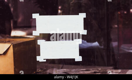 White note papers with curled corner and adhesive tape, ready for your message. Stock Photo