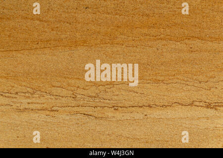 Yellow rough sand stone texture close up background. Stock Photo