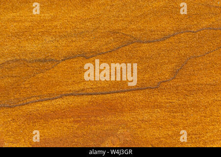 Yellow rough sand stone texture close up background. Stock Photo