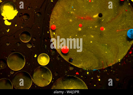 Abstract colorful acrylic paint flowing background. Planets like color bubbles. Stock Photo