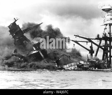 Destroyer USS Arizona, burning in floating drydock at Pearl Harbor after the Japanese attack on Pearl Harbor, Hawaii on December 7th, 1941 Stock Photo