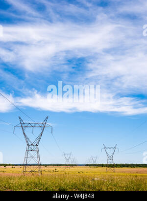 Power Lines and Towers Under a Cloudy Sky Stock Photo - Alamy
