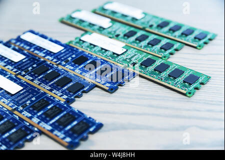 Different memory slots are on the wooden table. Stock Photo
